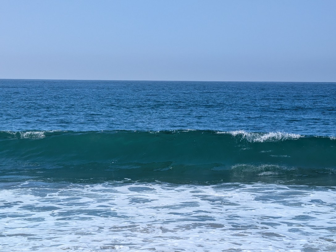 Ocean wave about to break representing breakthrough and transformation