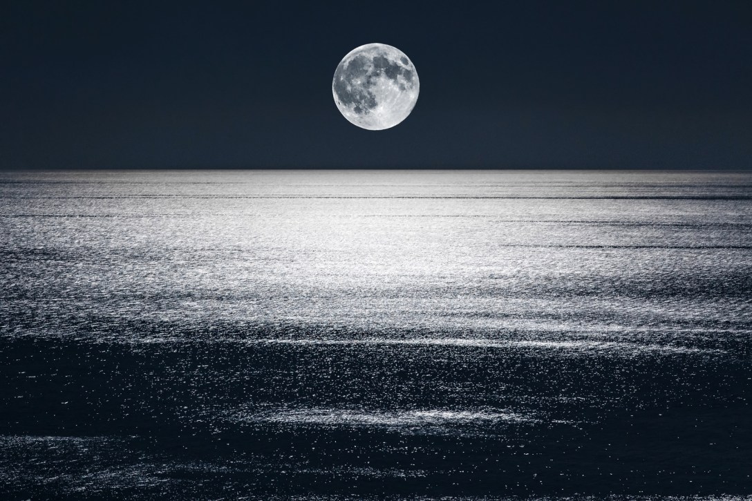 full moon over the ocean symbolizing a full niib release ritual