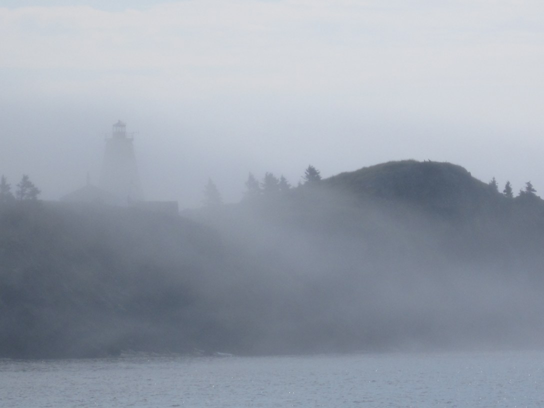Lighthouse in fog representing perfectionism and unclear decision-making under pressure